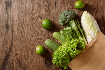 fresh vegetables in a brown paper bag