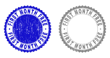 Grunge FIRST MONTH FREE stamp seals isolated on a white background. Rosette seals with grunge texture in blue and grey colors. Vector rubber watermark of FIRST MONTH FREE text inside round rosette.