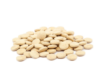 Tablets nutritional supplements vitamins on white background.