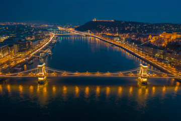 Fototapeta na wymiar Budapest, Hungary - Aerial skyline view of Budapest at blue hour with illuminated Szechenyi Chain Bridge, Elisabeth Bridge, Citadel taken from above River Daube