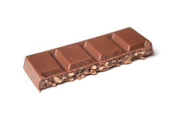 closeup of milk puffed rice chocolate blocks on white background