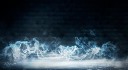 The background of an empty room with brick walls and concrete floor tiles. Neon light, spotlight, smoke