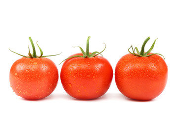 Fresh red tomatoes isolated on white background
