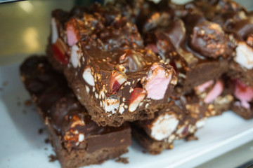 Delicious mixed muffins with apricot walnut topping bran muffin in a white paper tray freshly baked Europe savory 
