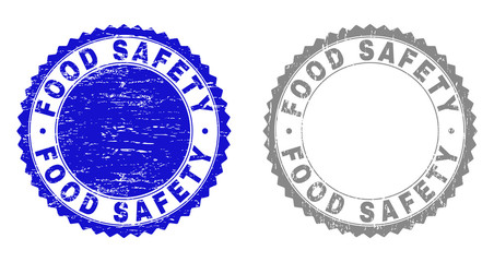 Grunge FOOD SAFETY stamp seals isolated on a white background. Rosette seals with grunge texture in blue and gray colors. Vector rubber stamp imprint of FOOD SAFETY label inside round rosette.