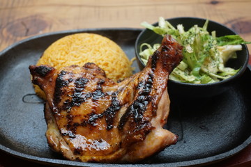 Filipino chicken thigh adobo barbecue with yellow rice and cabbage salad  traditional food Asian cuisine 
