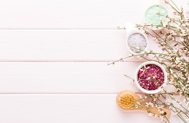 Beauty and fashion concept with spa set on pastel rustic wooden background.