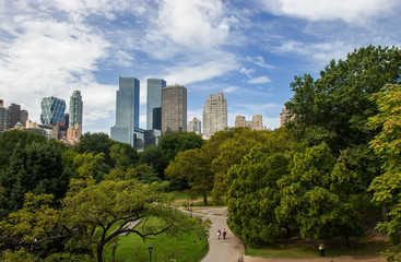 Panoramic view from Central Park to Manhattan skyscrapers at sunny day. New York City