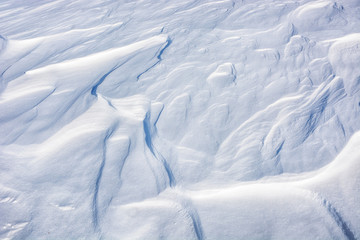 Close up background of fresh snow texture.