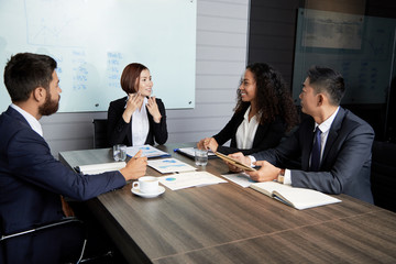 Smiling businesswoman explaining company perspectives
