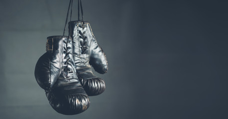 boxing gloves on the dark background - Powered by Adobe