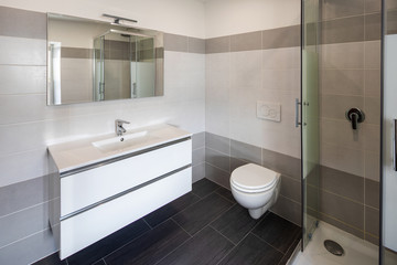 Bathroom with gray tiles and nobody inside