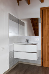 Sink detail with tiles and mirror