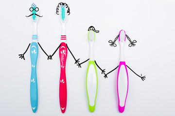 Toothbrushes on neutral background. Family hygiene concept.