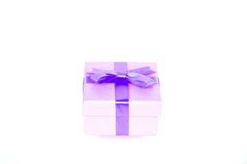 gift box with purple bow and white background