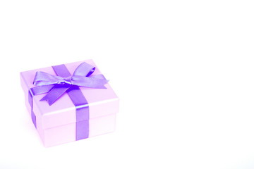 gift box with purple bow and white background