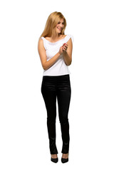 Young blonde woman applauding after presentation in a conference over isolated white background