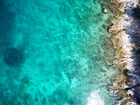top view of rocky shore crystal clear Adriatic Sea, drone shot © ZoomTeam