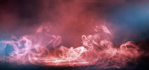 Red Smoke on a dark background. Dark empty room with rays of light, searchlight. Color correction, background.