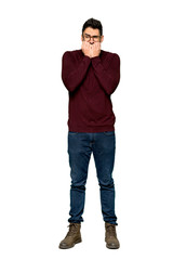 Fototapeta premium Full-length shot of Handsome man with glasses is a little bit nervous and scared putting hands to mouth on isolated white background