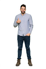 Fototapeta premium Full-length shot of Elegant man with shirt giving a thumbs up gesture with both hands and smiling on isolated white background