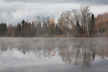 Beautiful autumn landscape of Kymijoki river waters in fog. Finland, Kymenlaakso, Kouvola.