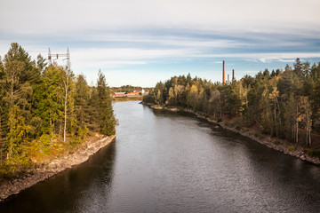 Naklejka na ściany i meble Autumn landscape of Kymijoki river waters in Finland, Kymenlaakso, Kouvola.