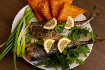 grilled mackerel fish under lemon