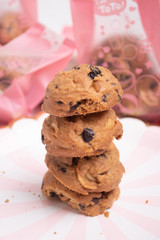 homemade Chocolate cookies on white line plate. closeup focus.