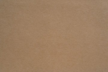 texture of old paper or other material closeup for a background or for wallpaper of brown straw color