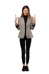Obraz premium A full-length shot of a Business woman making rock gesture over isolated white background