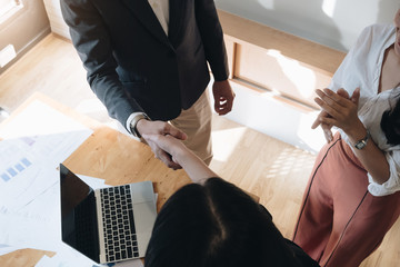 Above view of Business people shaking hands, finishing up meeting, business etiquette,...