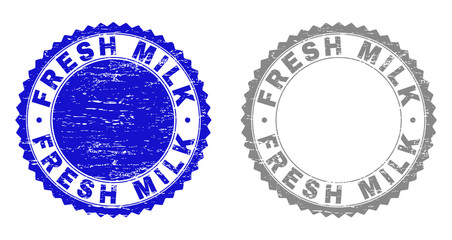 Grunge FRESH MILK stamp seals isolated on a white background. Rosette seals with grunge texture in blue and grey colors. Vector rubber stamp imitation of FRESH MILK text inside round rosette.