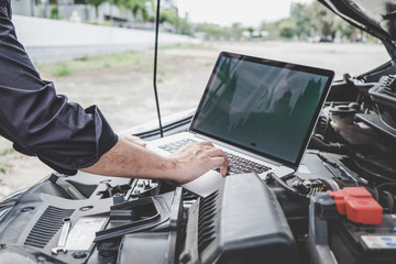 Services car engine machine concept, Automobile mechanic repairman checking a car engine with using...