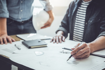 Engineer Teamwork Meeting, Drawing working on blueprint meeting for project working with partner on model building and engineering tools in working site, Construction and structure concept