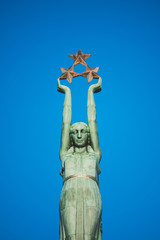 RIGA, LATVIA. cityscape. medieval streets of the old city in the center of Riga, Latvia. Monument of Freedom with statue of Liberty in Riga, symbol of independence and sovereignty.  © Gita Auzane