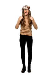 Full-length shot of Young woman with beret frustrated by a bad situation on isolated white background