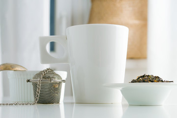 concept of drinking tea without plastic single use teabag. reusable  metalic infuser