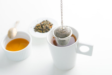 concept of drinking tea without plastic single use teabag. reusable  metalic infuser