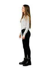 Full-length shot of young girl in lateral position on isolated white background