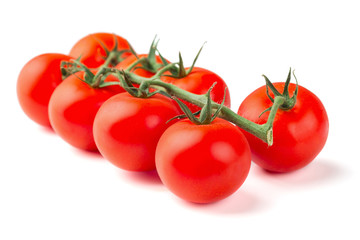 Ripe fresh cherry tomatoes on branch isolated on white background