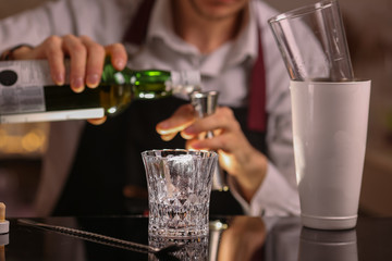 Fresh alcohol Penicillin cocktail with orange slice and ice cubes. Barmen making alcohol cocktail	