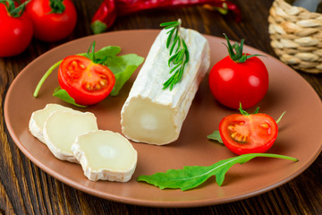 Fototapeta na wymiar Graviera greek cheese on clay plate.