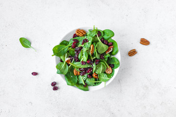 Spinach salad with pecan nuts and cranberries