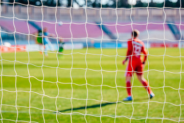 Soccer photo, football net, goalkeeper in background