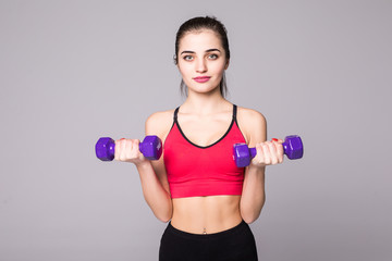 Fototapeta na wymiar Fitness young woman working out with dumbbell isolated on white background