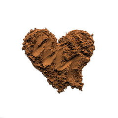 Cocoa powder or coffee in the shape of a heart. Concept- love, recipes, menus, preparation of drinks. Empty space for text or description. Isolated on white.