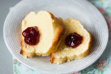 Two slices of curd cake of cheese cake with strawberry jam