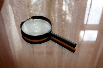 Magnifying glass on table