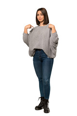 A full-length shot of a Young woman with surprise facial expression over isolated white background